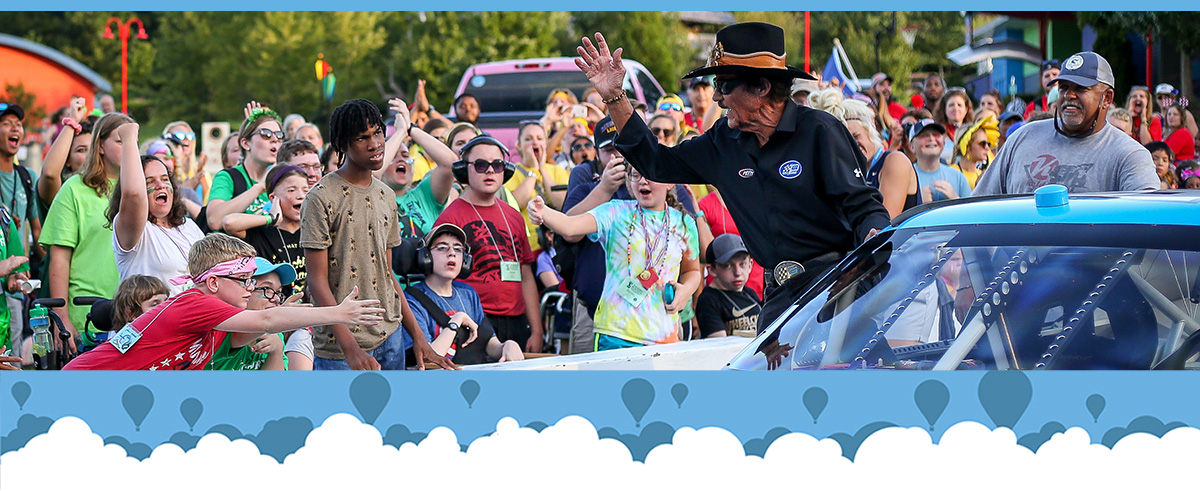 Richard Petty waving to campers