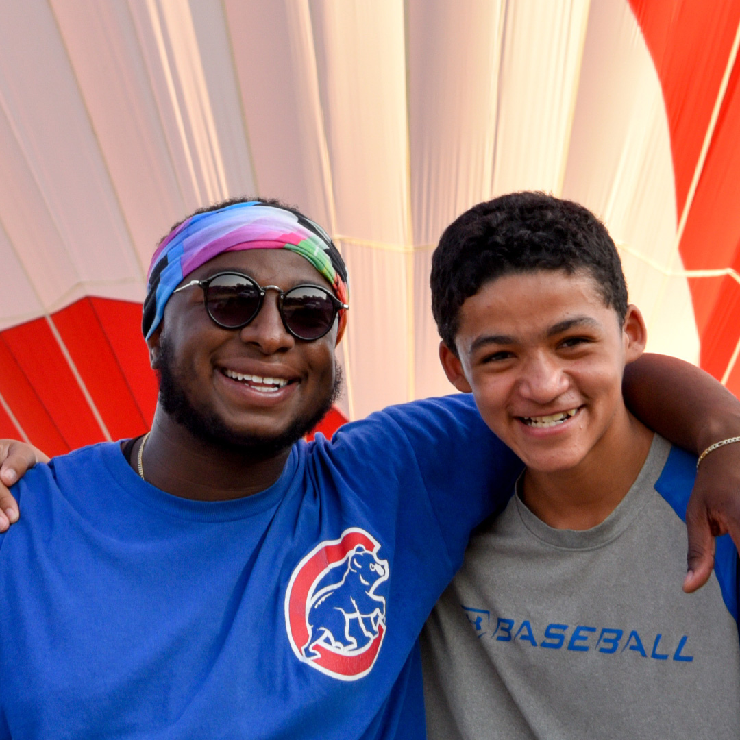 DJ with a camper at NASCARnival during summer 2017.