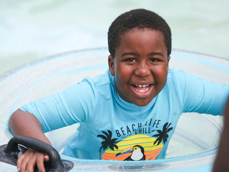 General-Awareness-Landing-Page-Image-3-800x600 Camper in inner tube smiling at the waterpark