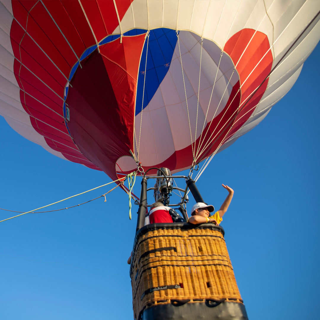 A camper enjoys a tethered hot air balloon ride at NASCARnival.