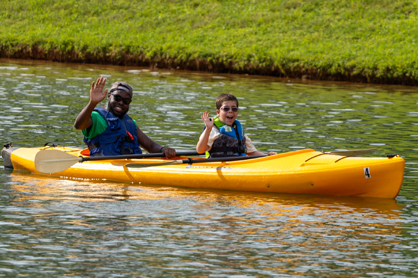 Counselor and camper in a kayak