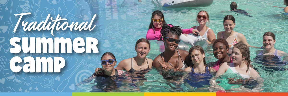 Traditional Summer Camp Banner 1200x400 Campers smile together in the Victory Junction water park during a traditional summer camp session.