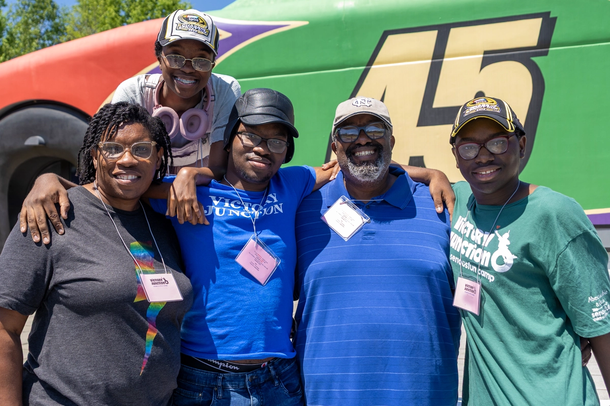 Family poses together during a Family Weekend at Victory Junction.