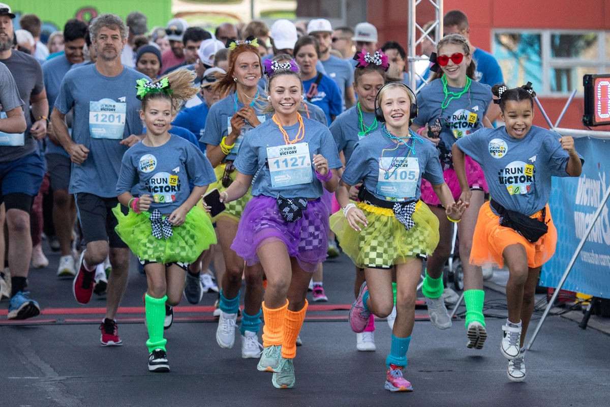 Young runners race from the starting line during Victory Junction’s Run to Victory 5K and Fun Run.