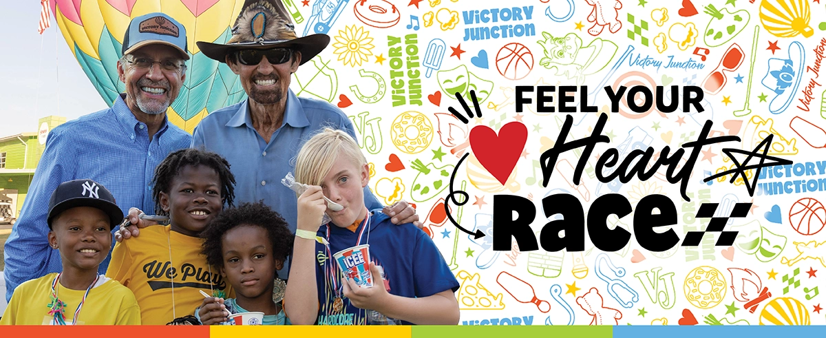 Kyle Petty and Richard Petty with Victory Junction campers beside the message “Feel Your Heart Race.”