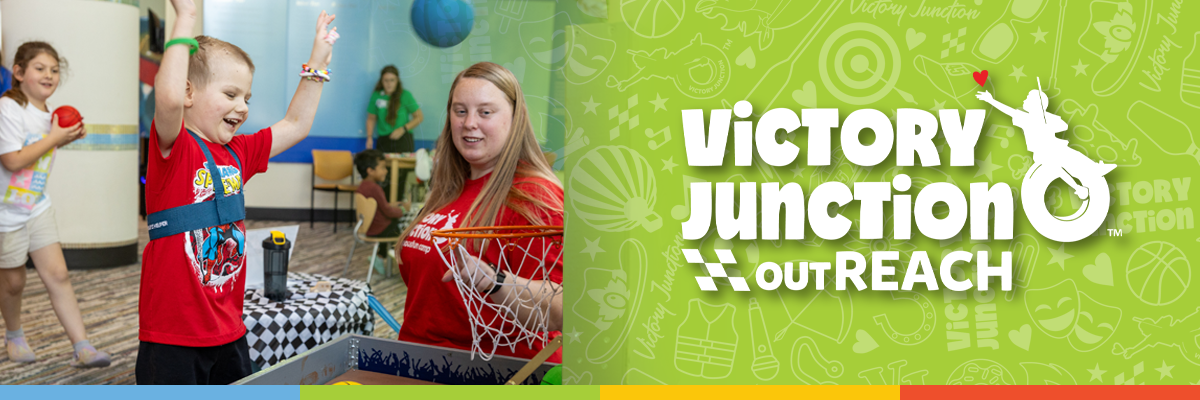 2026 OUTREACH Logo Banner 1200x400 A child celebrates while playing basketball with a Victory Junction outREACH team member, alongside the Victory Junction outREACH logo on a bright green background.